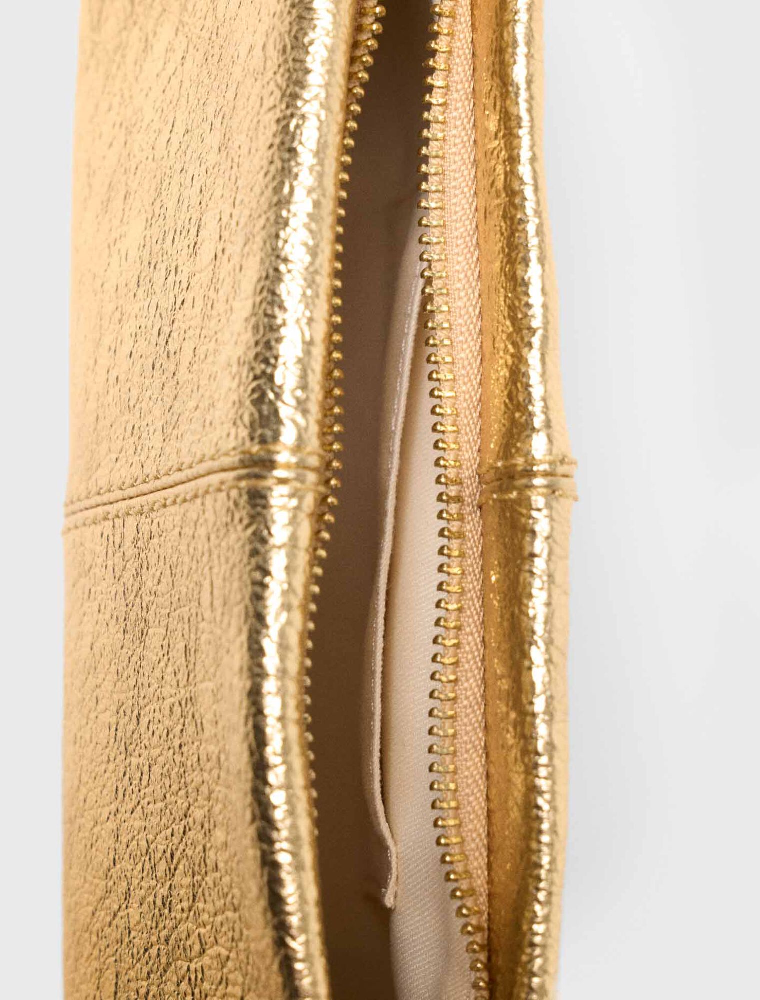 Metallic Miss M clutch bag