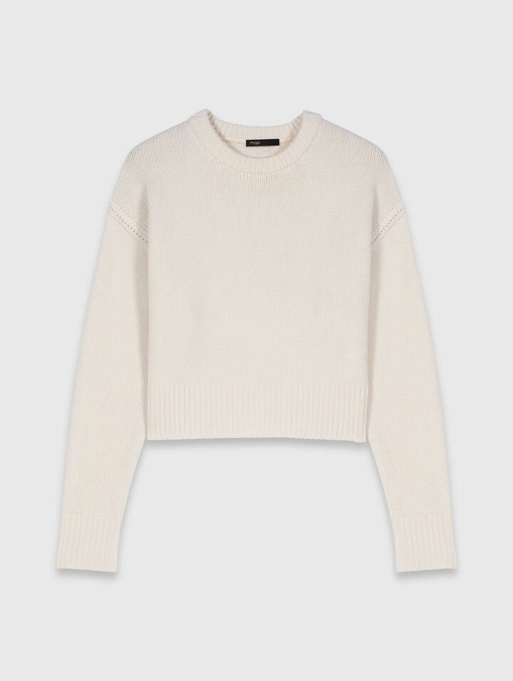 Jumper with floral brooch