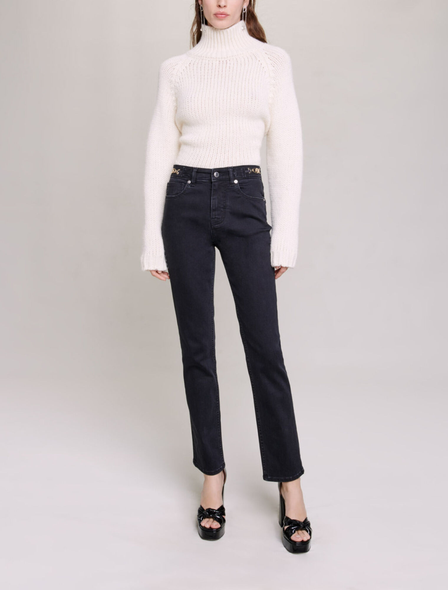 Jeans with curb chains and fringing