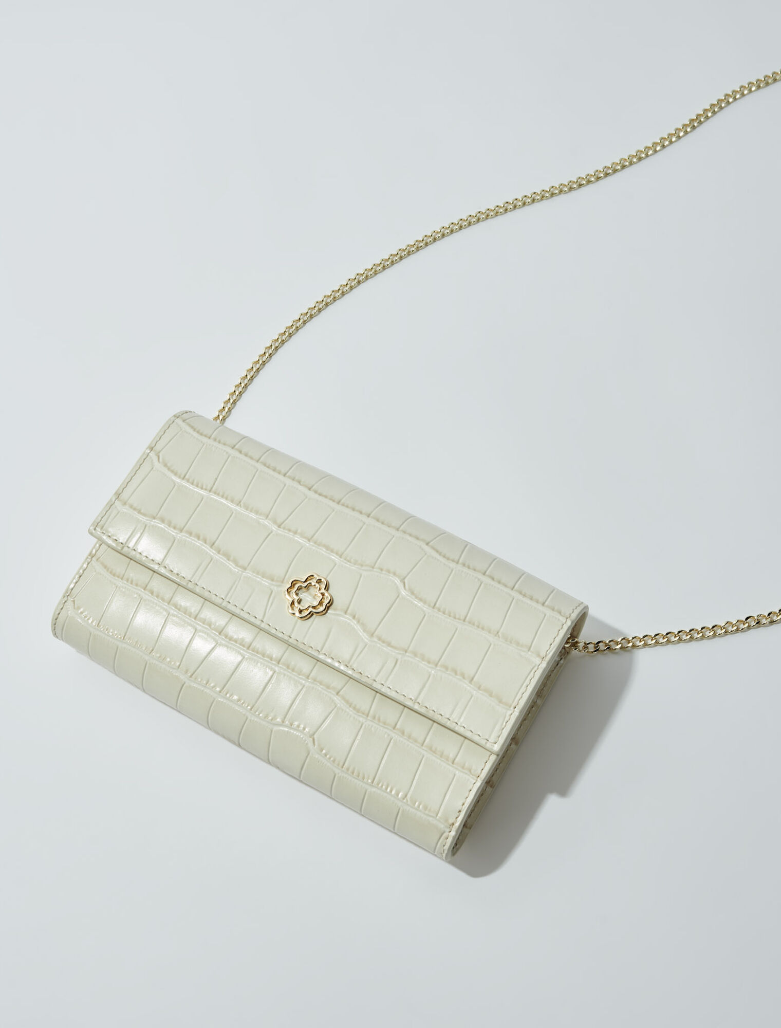 Croc-effect embossed leather bag