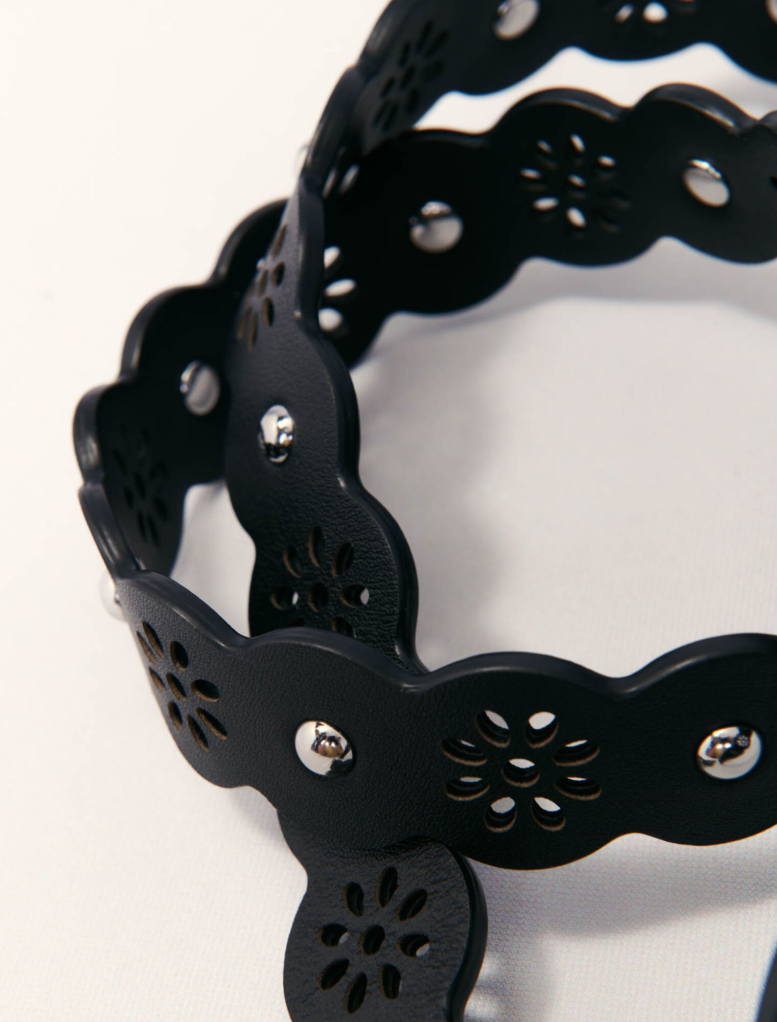 Perforated flower-style strap