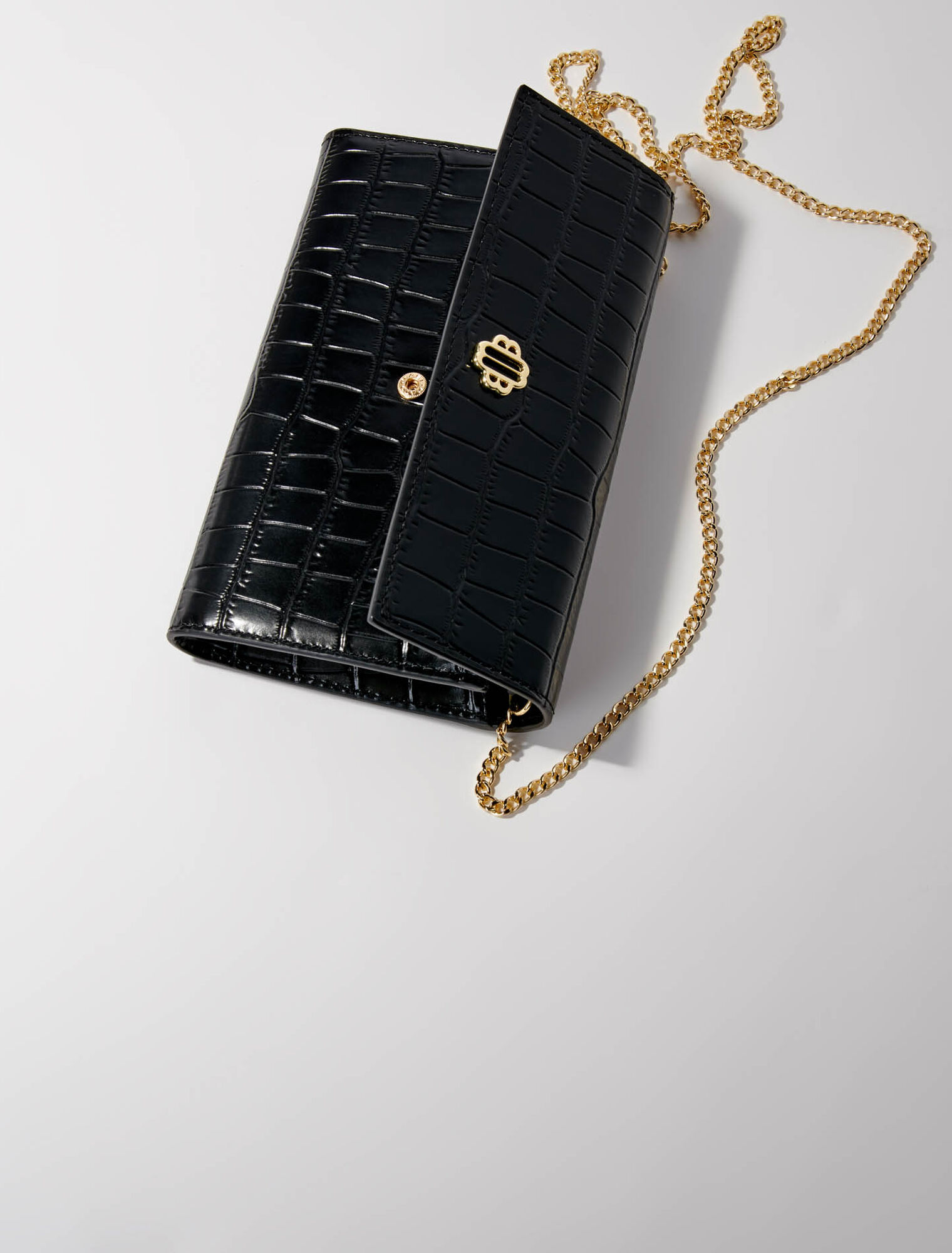 Croc-effect embossed leather bag - Clutch bags | Maje