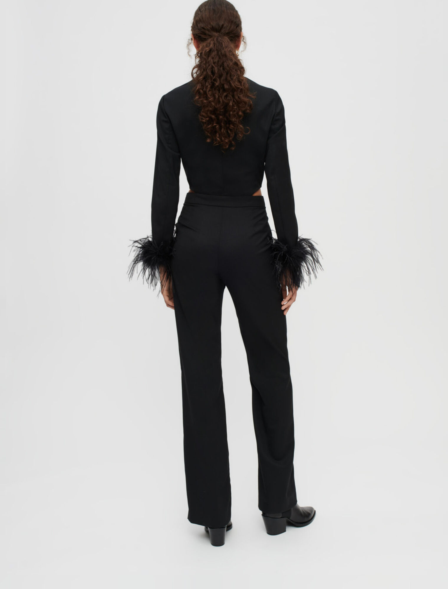 Combination pants in black with feathers
