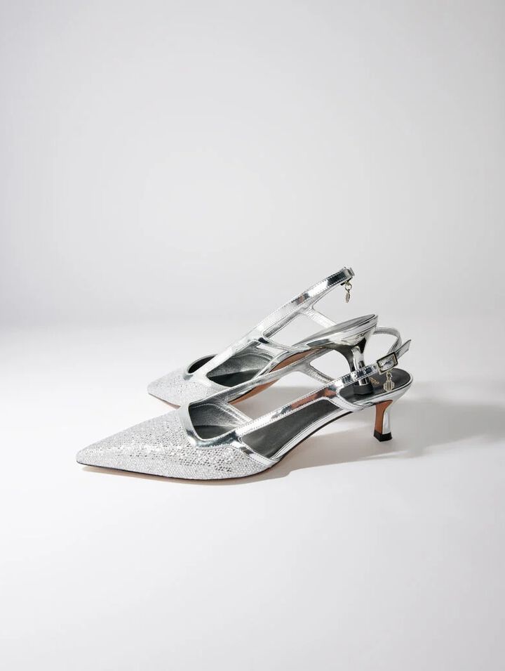 Pointed silver pumps