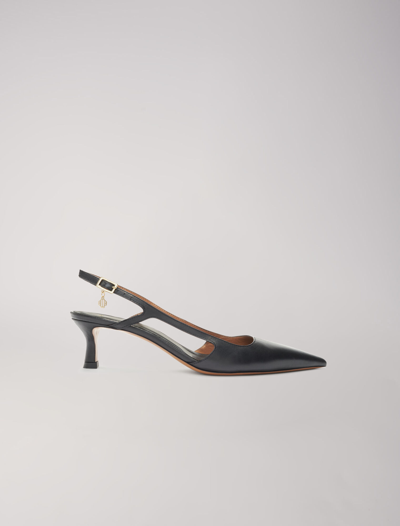 Pointed-toe pumps with straps
