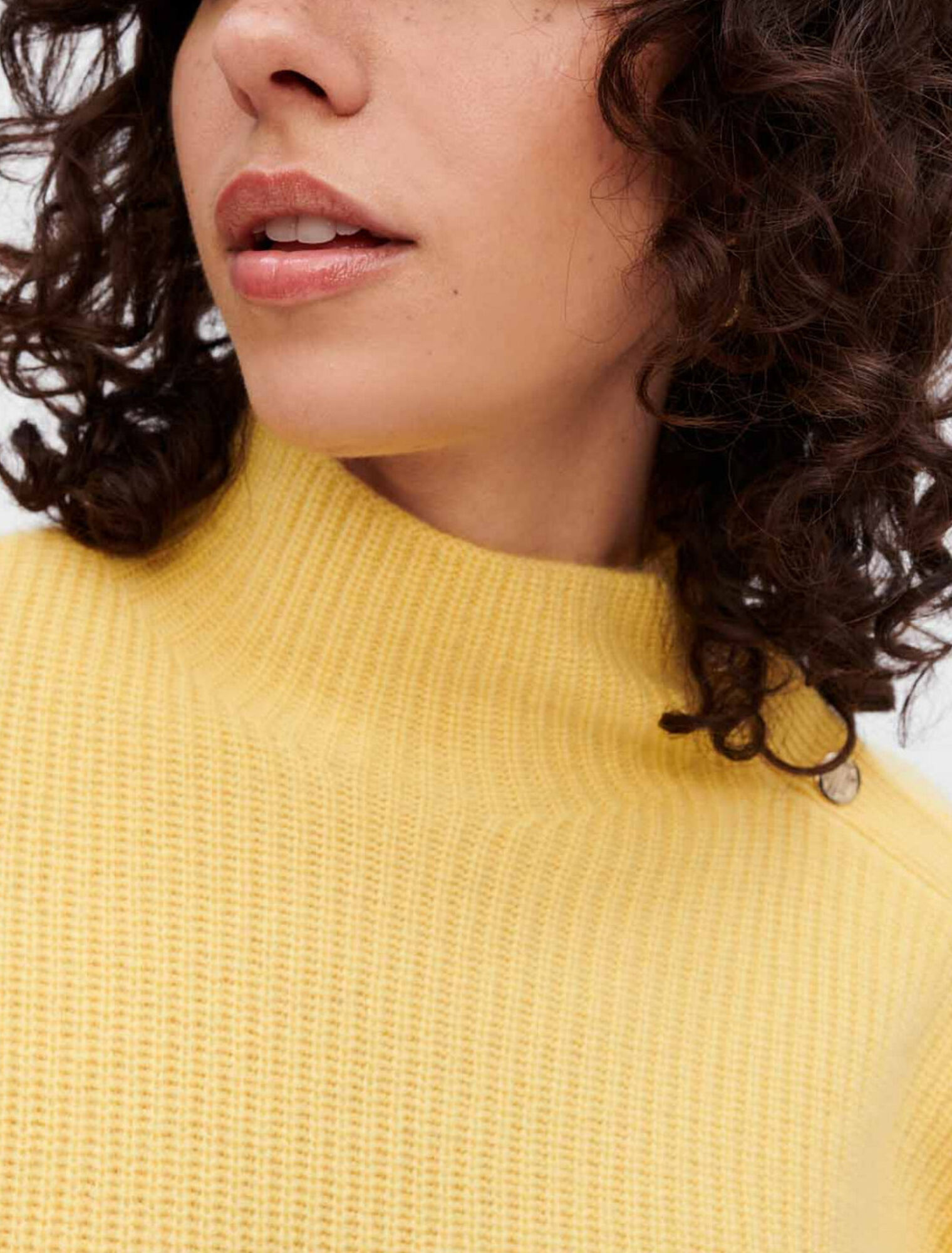 Cashmere sweater with gold press studs
