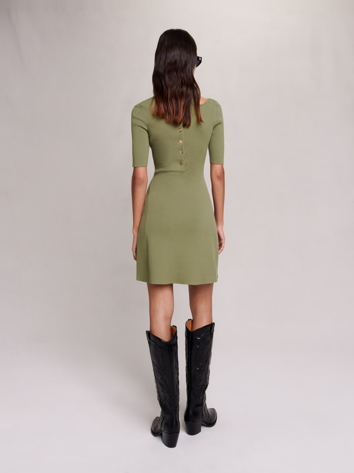 Knit dress with cut out at the shoulder