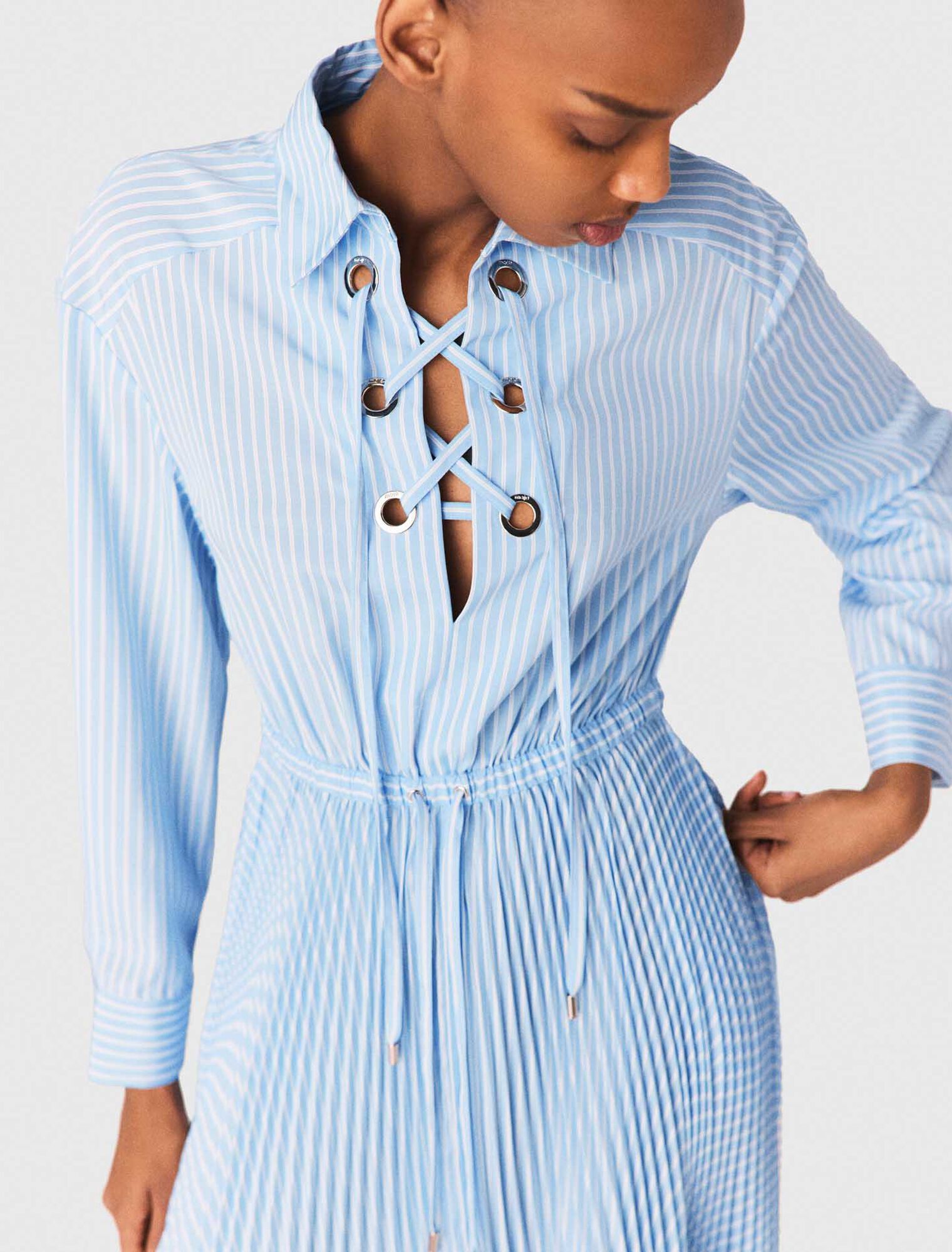 Long pleated dress with eyelets