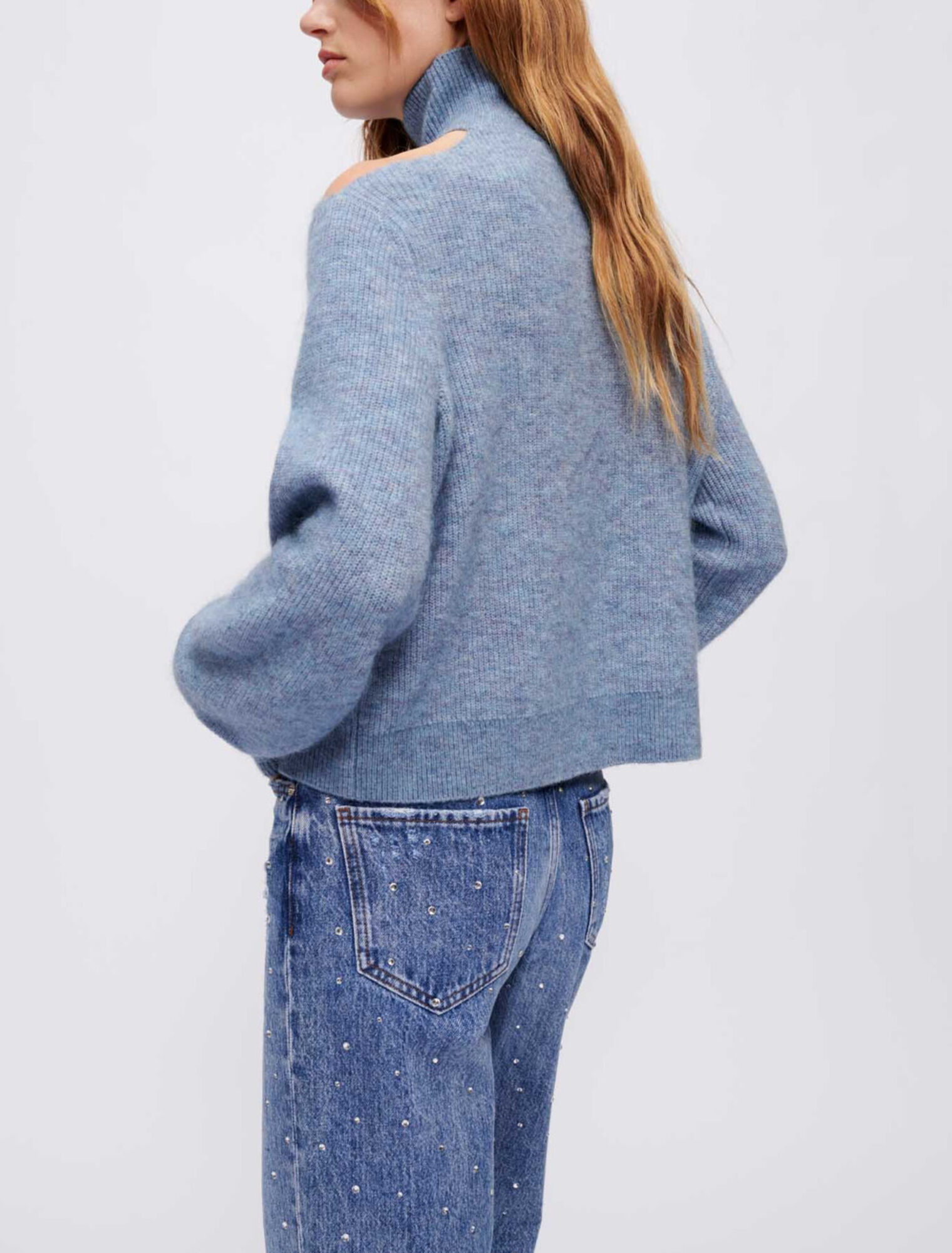 High-neck sweater with open shoulder