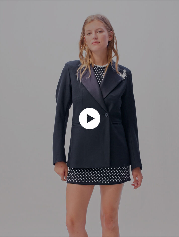 Suit jacket with brooch