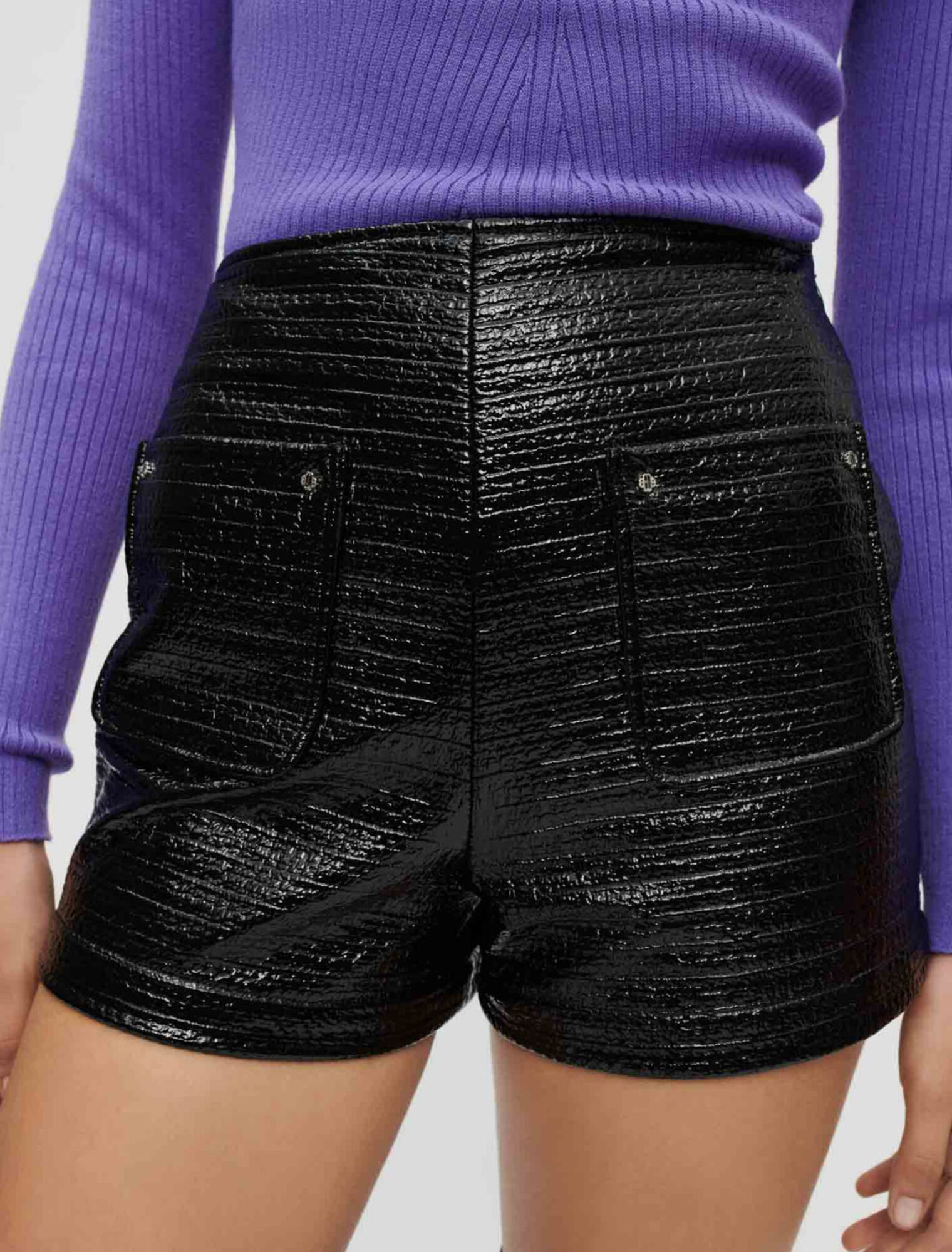 Embossed tweed and black vinyl shorts