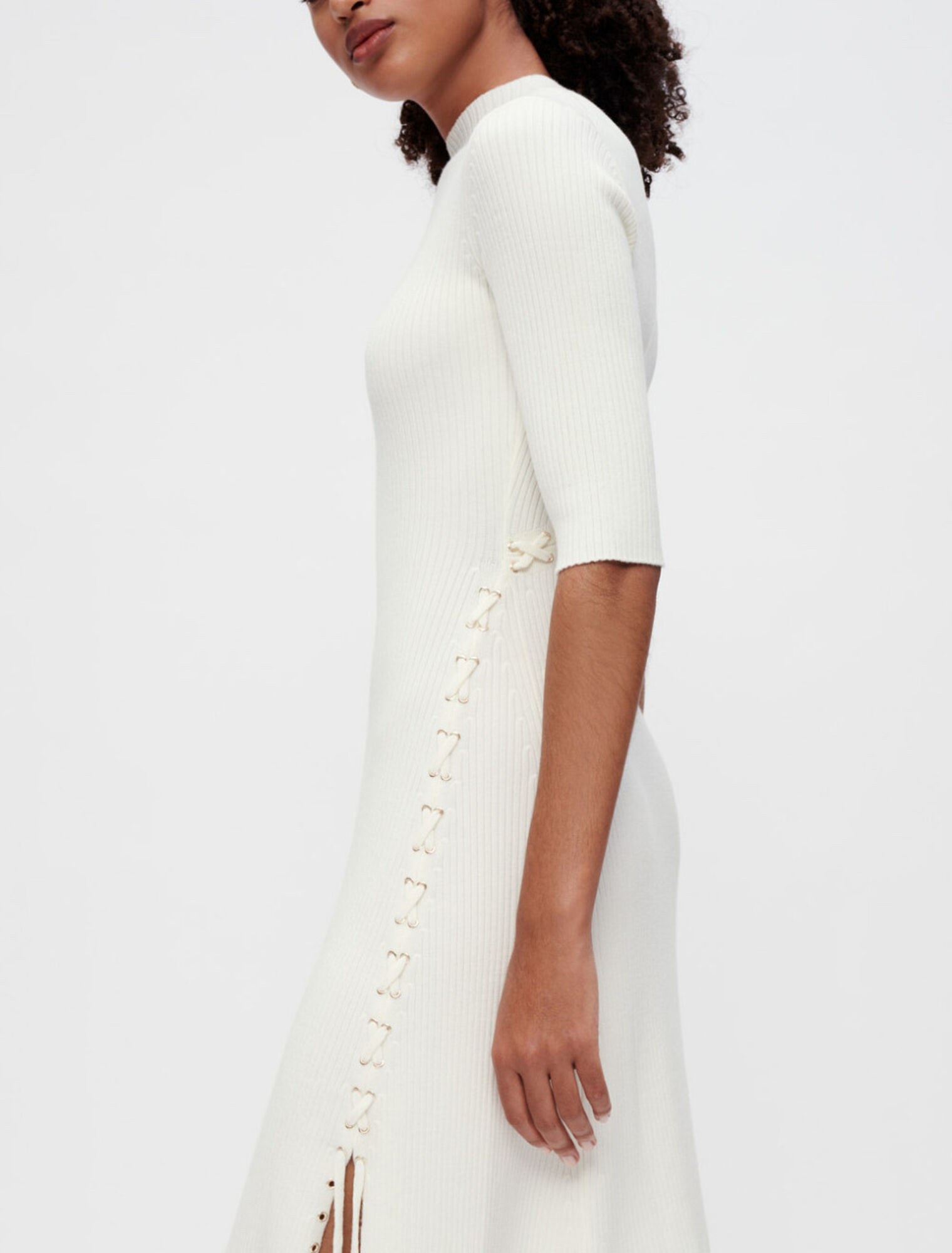 Ribbed knit dress with gold eyelets