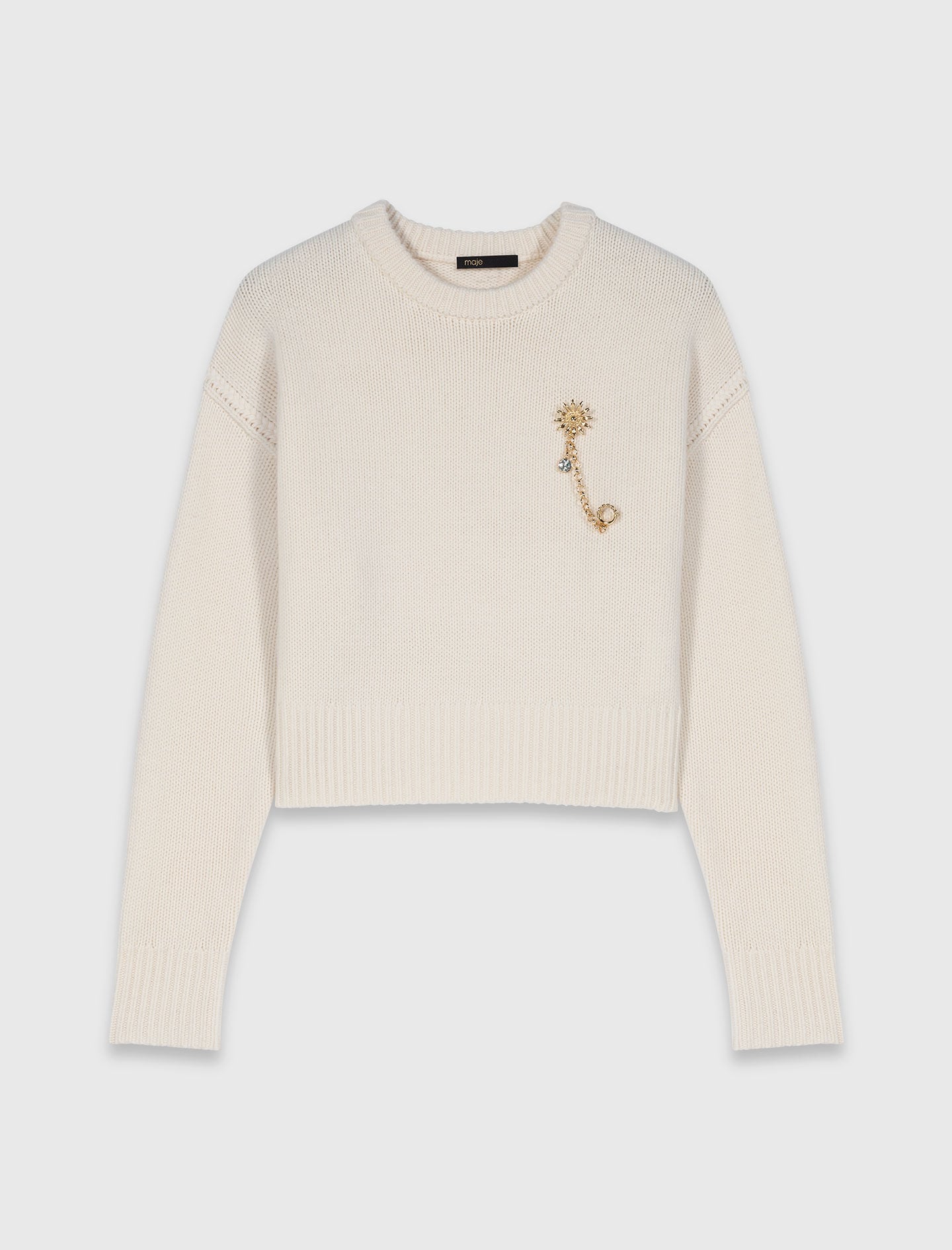 Jumper with floral brooch 6