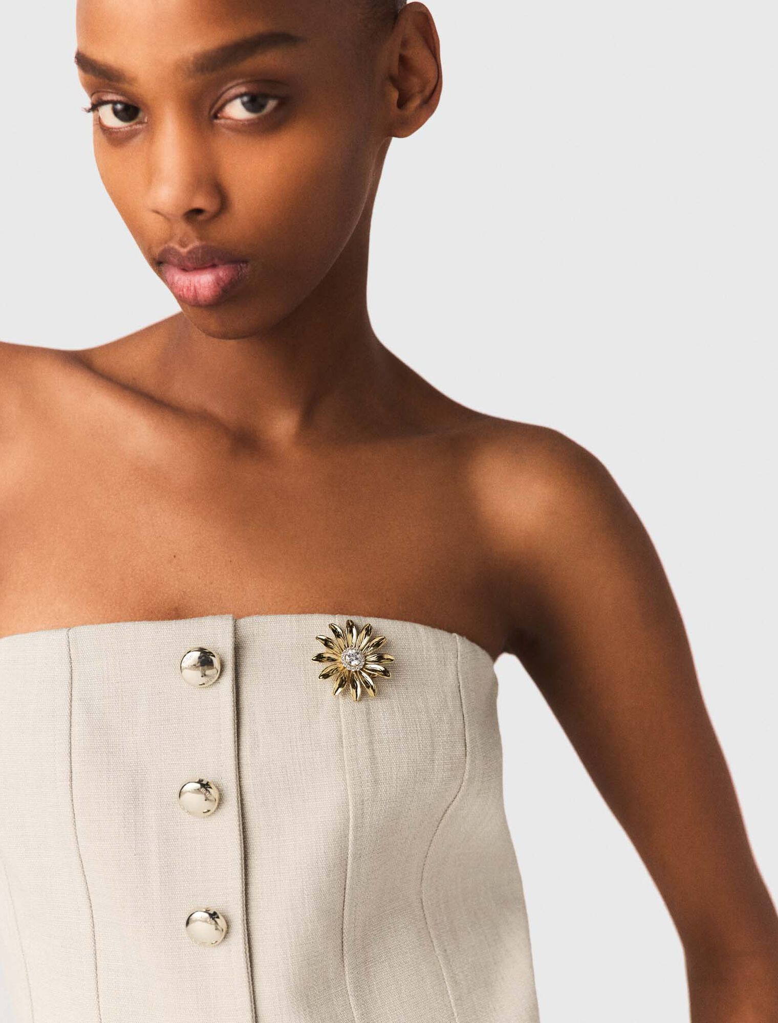 Gold rhinestone flower brooch